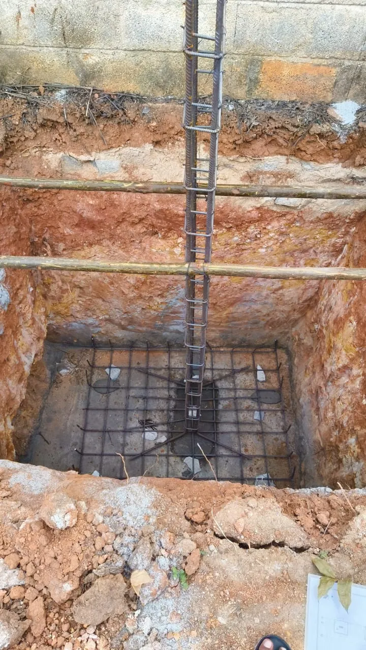 Footing reinforcement placed in an excavated pit