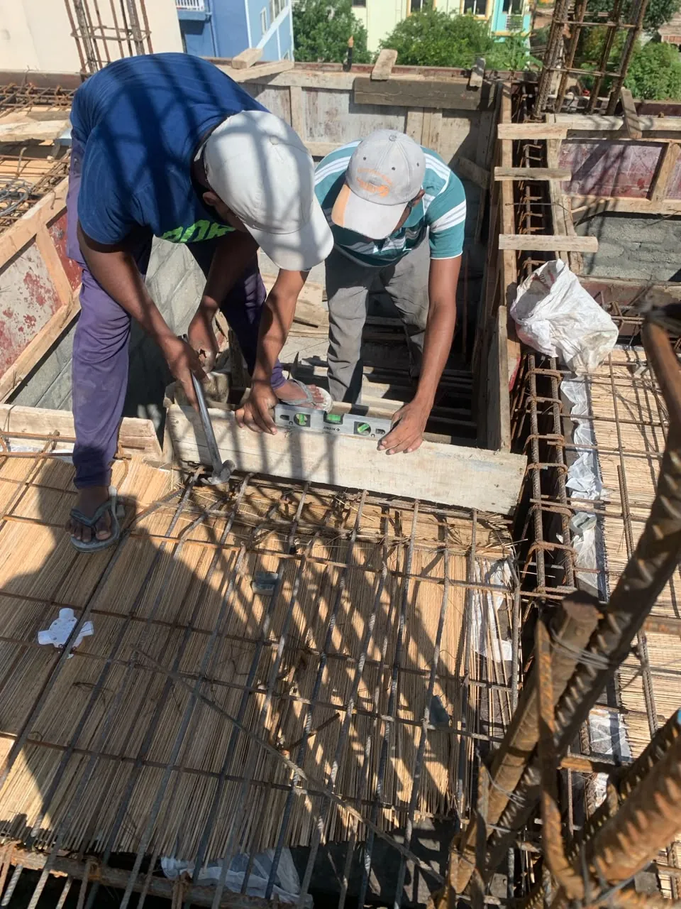 Slab reinforcement being tied and checked on site before a concrete pour