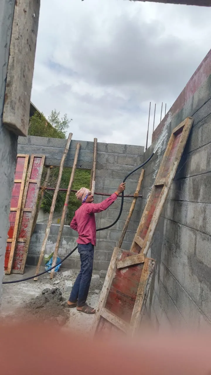 Plastering work in progress on an external wall