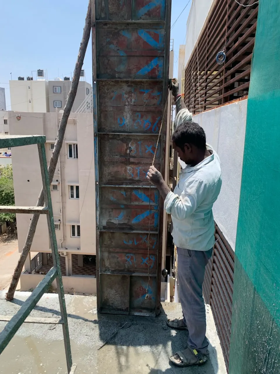 Column shuttering being aligned before a pour