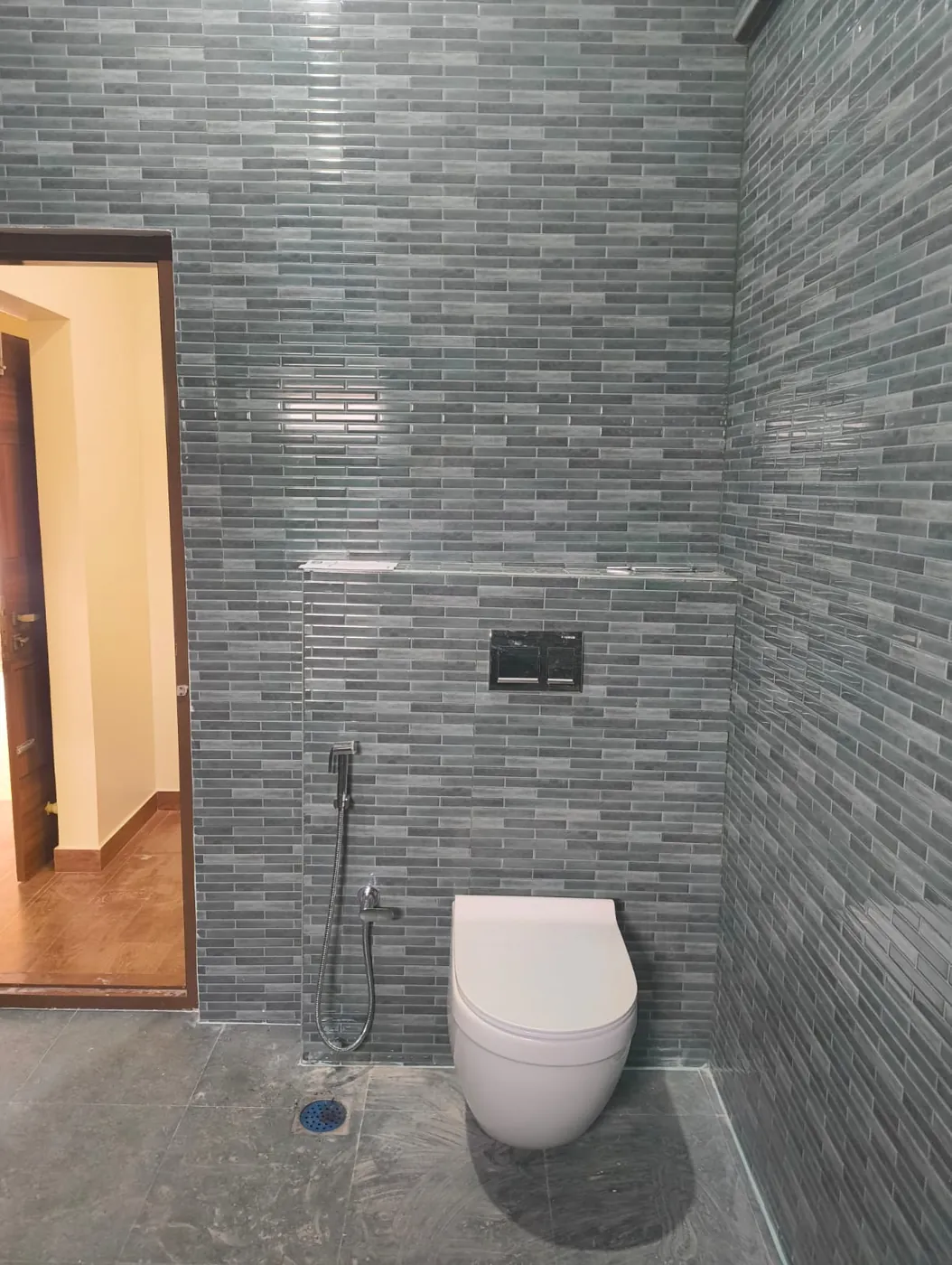 Bathroom finished in grey mosaic tiling